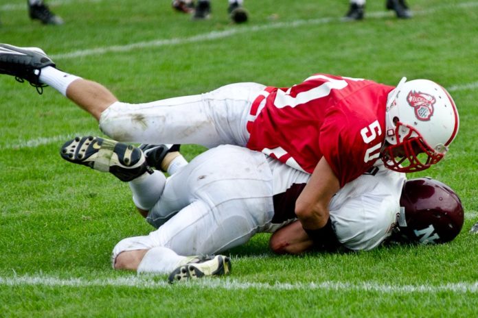 Raider tackling Huegenot (Photo by Marcy Zitz)