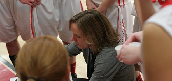 Coach Pam White advises her team