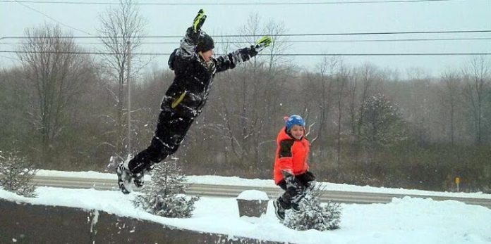 Logan_age10_and_Cameron_age7_take_flight_in_Red_Hook ADJ