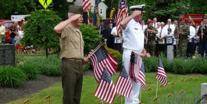Navy Seal Frank Ackley and Senior Chief Chuck Simmons salute the fallen as they place the flags at the Red Hook Memorial Day ceremony. (1024x683)