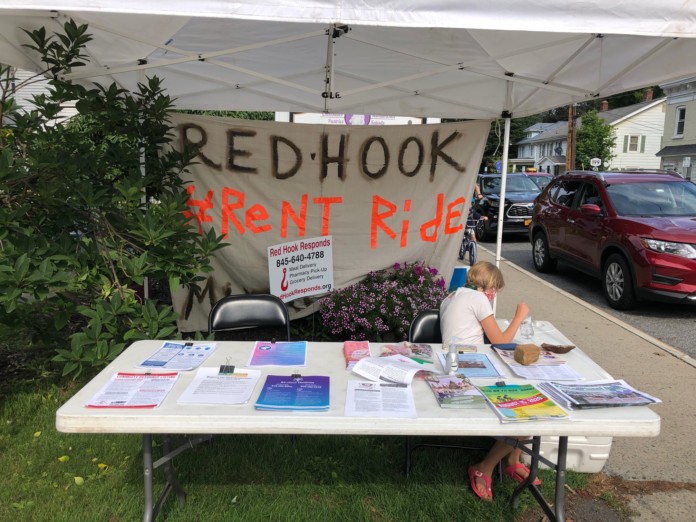 Red Hook #RentRide check-in Red Hook #RentRide Mutual Aid check-in table