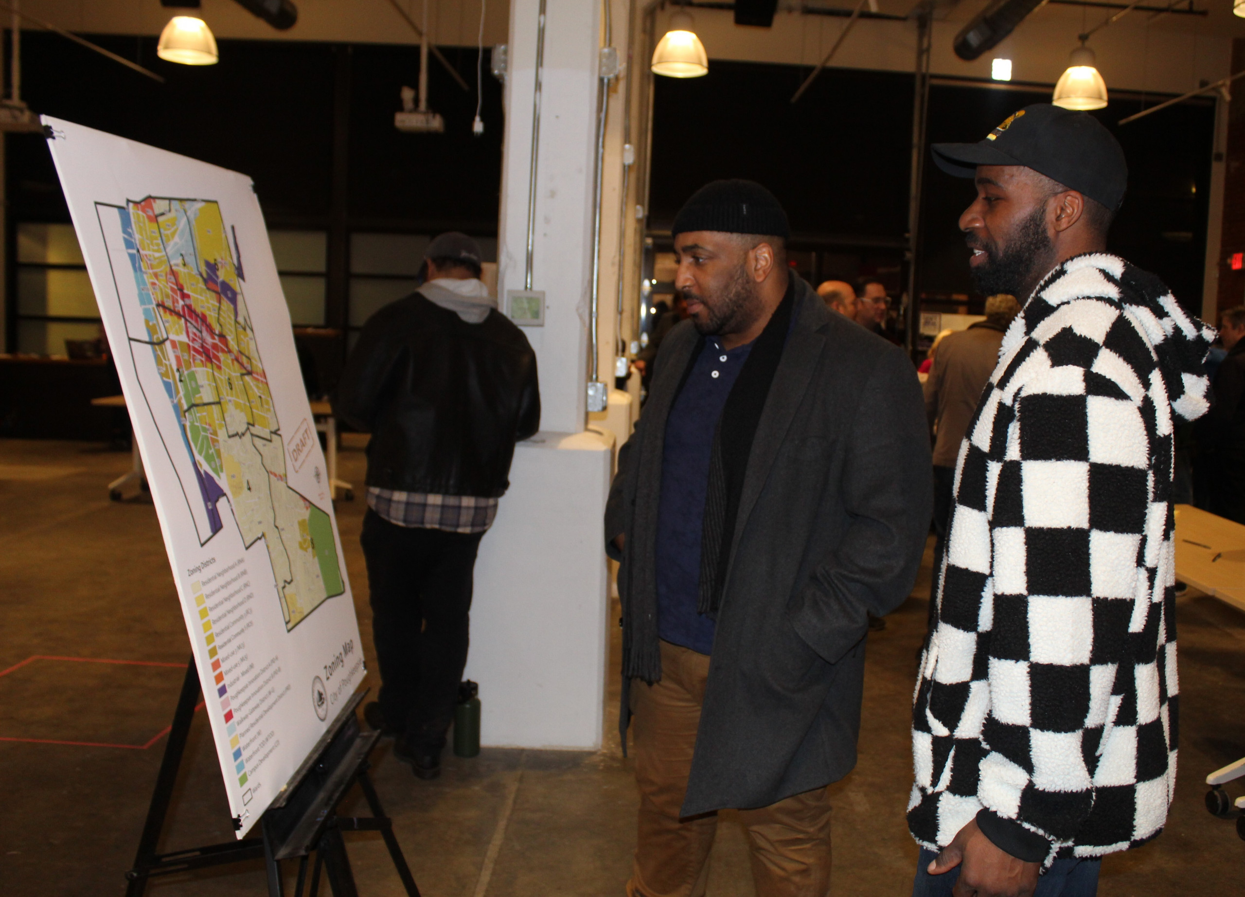 Meeting attendees review zoning map